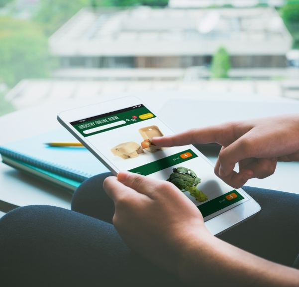 person holding tablet to identify consumer touchpoint