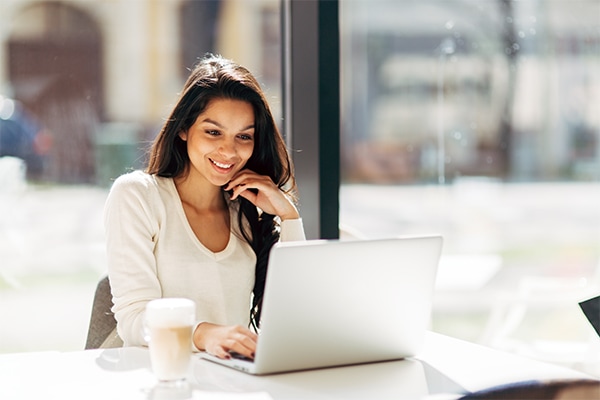 woman on laptop helping map consumer pathways