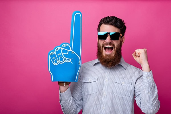 Man signifying #1 Richmond VA SEO Agency with a foam finger.