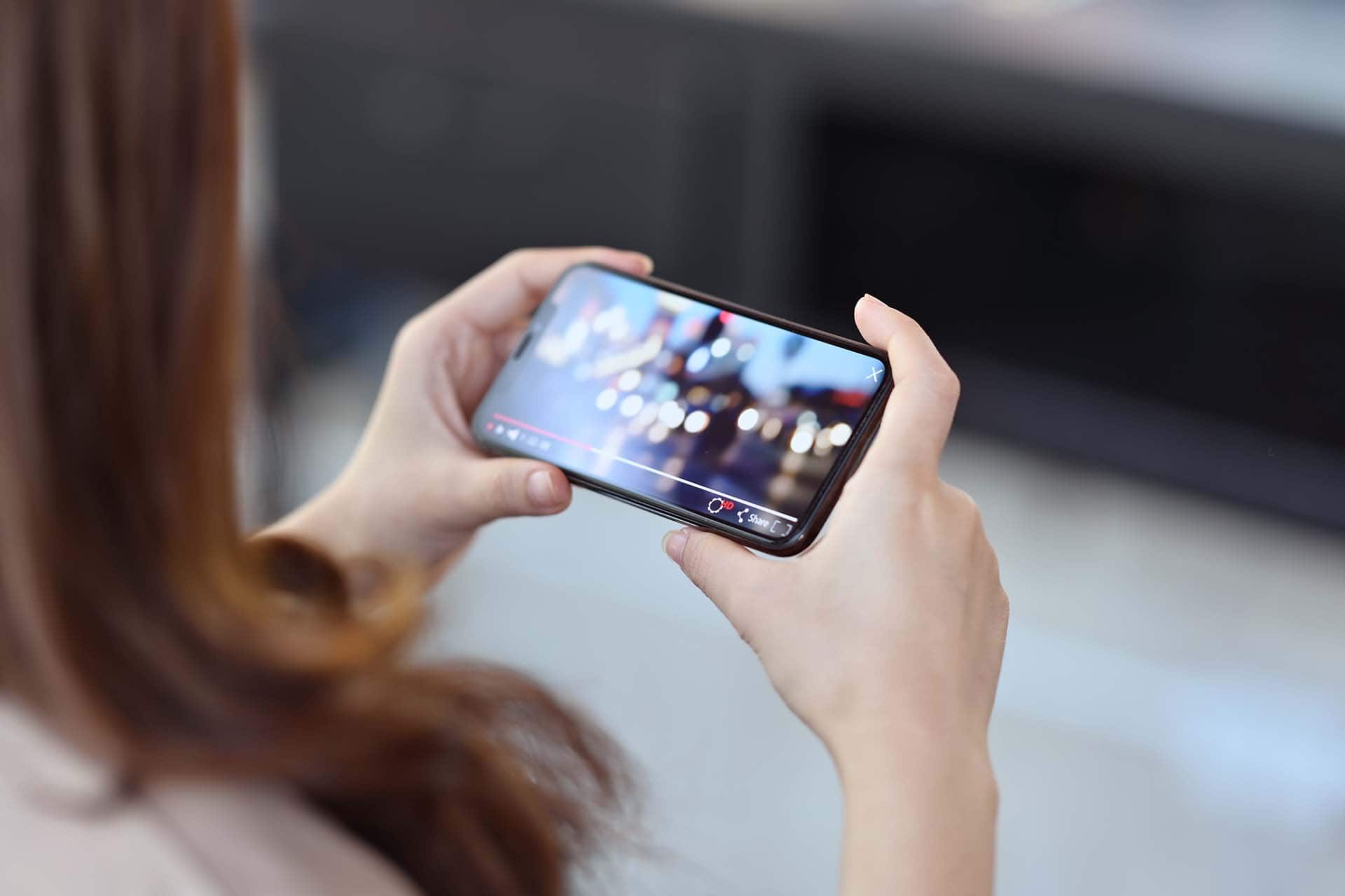 man tapping the search bar on a screen