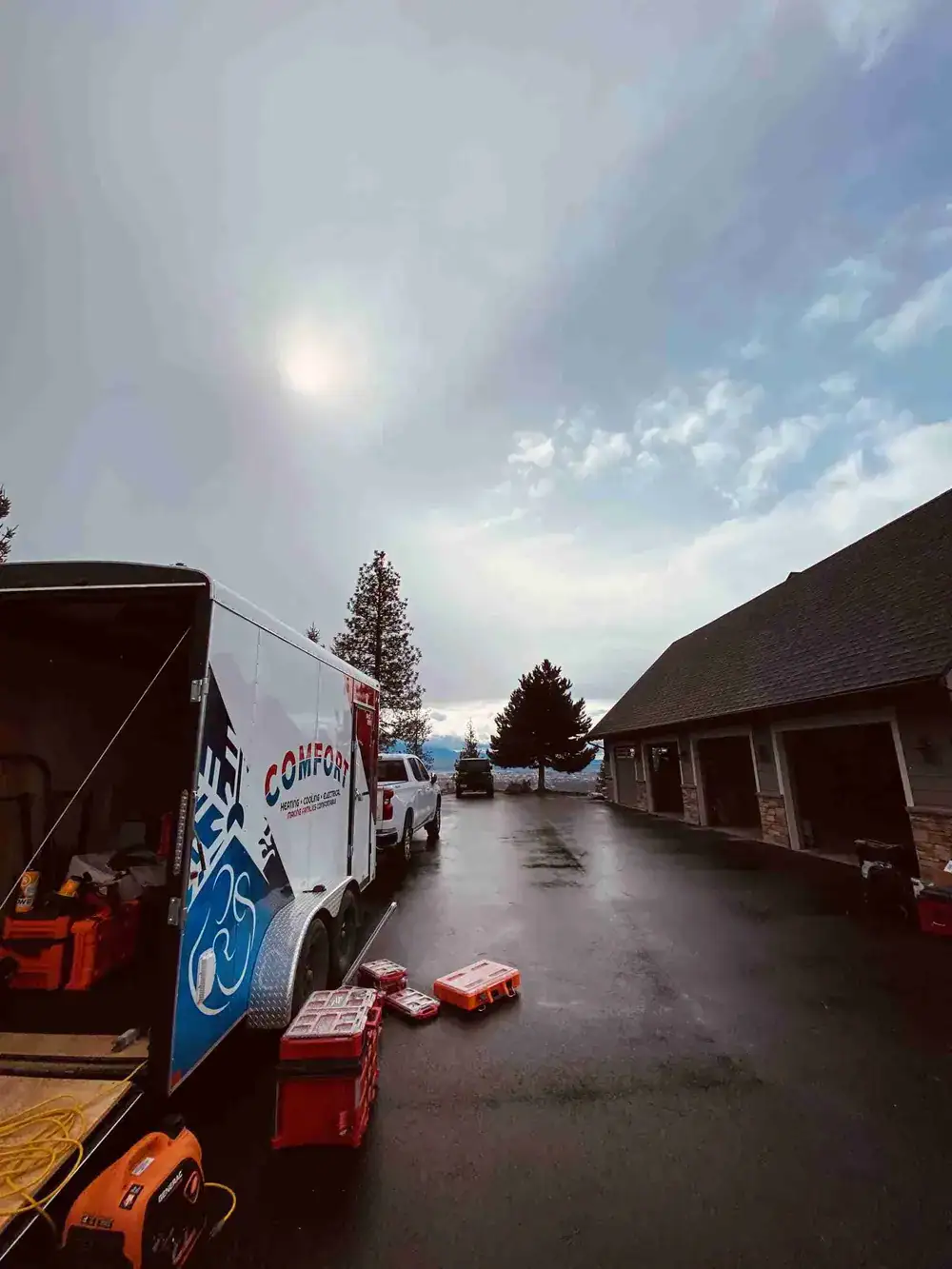 Comfort Heating and Air Vehicle with cloudy sky