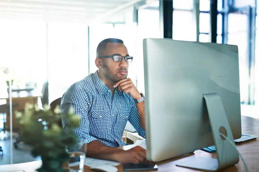 Man conducting research at computer
