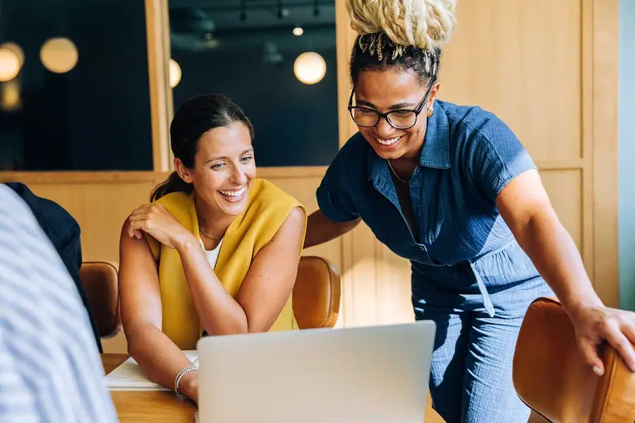 Two women collaborate on strategy