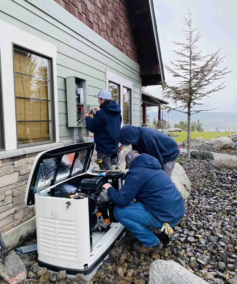 Technicians working on generator