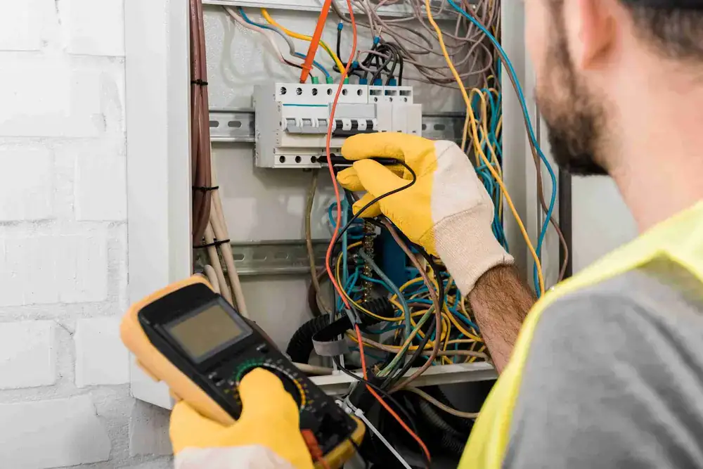 Technician working on power box