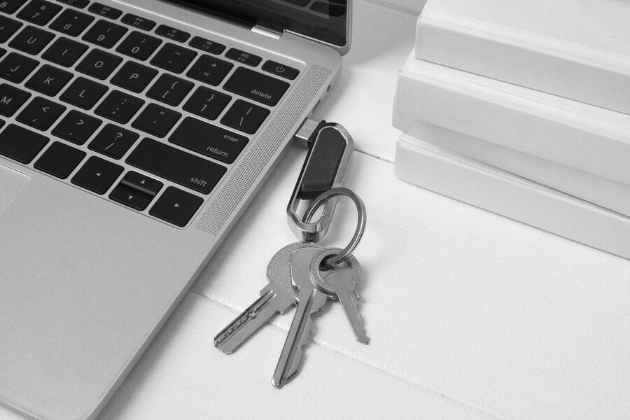 own your website, laptop with key ring
